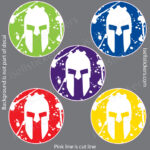 Six colorful circular Spartan helmet decals arranged on a gray background.